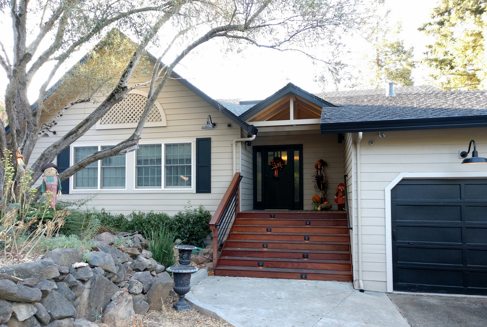 Remodeled entry - gables, eaves added, deck, railing, lighting